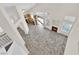 Open-concept living room with high ceilings, tile flooring, fireplace, and sliding glass doors at 7213 Buglehorn St, Las Vegas, NV 89131