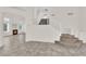 Bright living room featuring tile floors, a staircase, and a cozy fireplace in a modern design at 7213 Buglehorn St, Las Vegas, NV 89131