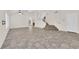 Spacious living room with vaulted ceiling, tile floors, natural light, and staircase to the upper level at 7213 Buglehorn St, Las Vegas, NV 89131