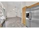 Spacious living room with vaulted ceilings, kitchen, fireplace and stainless fridge at 7213 Buglehorn St, Las Vegas, NV 89131