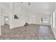 Spacious living room with vaulted ceiling, tile floors, natural light, and staircase to the upper level at 7213 Buglehorn St, Las Vegas, NV 89131