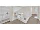 View of staircase with white railings overlooking the living room and kitchen at 7213 Buglehorn St, Las Vegas, NV 89131