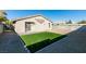 This home features a well maintained backyard with artifical turf and gravel at 7437 Lattimore Dr, Las Vegas, NV 89128