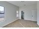 Bedroom with neutral carpet, a double door closet and two windows with backyard views at 7437 Lattimore Dr, Las Vegas, NV 89128