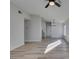 Dining area with modern chandelier, wood-look floors, and wet bar at 7437 Lattimore Dr, Las Vegas, NV 89128
