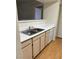 Apartment kitchen featuring neutral cabinets, white countertops, and stainless steel sink at 8101 W Flamingo Rd # 1073, Las Vegas, NV 89147