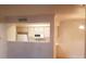 Open-concept kitchen with white countertop, cabinets, and open access to dining or living area at 8101 W Flamingo Rd # 1073, Las Vegas, NV 89147