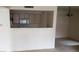 Bright kitchen with white cabinets, a double sink, and a breakfast bar that opens into the living space at 8101 W Flamingo Rd # 1073, Las Vegas, NV 89147