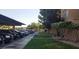 Community parking area with a view of the landscape, and a grass area at 8101 W Flamingo Rd # 1073, Las Vegas, NV 89147
