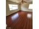 Spacious bedroom with gleaming hardwood floors and bright windows at 8149 Palace Monaco Ave, Las Vegas, NV 89117