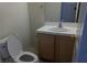 Half bathroom featuring a vanity, sink, and a toilet at 8332 Shore Breeze Dr, Las Vegas, NV 89128