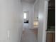 Long hallway leading to multiple rooms, connecting different areas of the home with a smooth transition at 8332 Shore Breeze Dr, Las Vegas, NV 89128