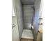 Updated shower with grey tiled walls and a rainfall shower head at 834 Benita Pl, Boulder City, NV 89005