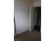 Image of a bedroom with a sliding door closet and brown carpet at 834 Benita Pl, Boulder City, NV 89005