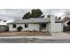 Charming single-story home featuring a low pitched roof, small windows, and stucco chimney at 834 Benita Pl, Boulder City, NV 89005