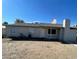 A single-story house featuring a low-pitched roof, small windows, and stucco chimney at 834 Benita Pl, Boulder City, NV 89005