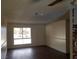 An empty room featuring wood floors and natural light at 834 Benita Pl, Boulder City, NV 89005