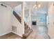 Inviting entryway with staircase, tile flooring, and a bright living room with a fireplace at 8425 Sewards Bluff Ave, Las Vegas, NV 89129