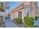 Charming home featuring stucco siding, a tile roof, and manicured landscaping at 8425 Sewards Bluff Ave, Las Vegas, NV 89129