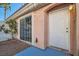 Home featuring stucco siding, a sliding glass door, and desert-style landscaping at 8425 Sewards Bluff Ave, Las Vegas, NV 89129