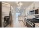 Bright kitchen with stainless steel appliances and white cabinets at 8425 Sewards Bluff Ave, Las Vegas, NV 89129