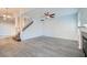 Spacious living room with gray tile flooring, a staircase and a modern fireplace at 8425 Sewards Bluff Ave, Las Vegas, NV 89129