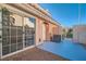 Comfortable patio adjacent to sliding glass doors, leading to a home's interior at 8425 Sewards Bluff Ave, Las Vegas, NV 89129