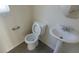 Bathroom includes a pedestal sink and toilet at 8695 Canfield Canyon Ave, Las Vegas, NV 89178