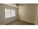 Bedroom featuring a window and neutral walls and flooring at 8695 Canfield Canyon Ave, Las Vegas, NV 89178