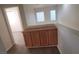 Hallway includes natural light and wooden cabinets for storage at 8695 Canfield Canyon Ave, Las Vegas, NV 89178