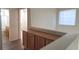 Hallway with natural light and wooden cabinets provides ample storage at 8695 Canfield Canyon Ave, Las Vegas, NV 89178