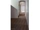 Hallway featuring neutral walls and patterned carpet leading to a bright room at 8749 Brilliant Star Dr, Las Vegas, NV 89178