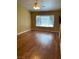 Bright living room with wood floors and a large window at 9014 Sierra Palms Way, Henderson, NV 89074