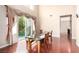 A well-lit dining room with backyard access and sleek hardwood flooring at 916 Granger Farm Way, Las Vegas, NV 89145
