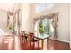 A large, open dining area with hardwood flooring and backyard views at 916 Granger Farm Way, Las Vegas, NV 89145