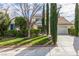 Charming home featuring a lush green lawn and well-manicured bushes at 916 Granger Farm Way, Las Vegas, NV 89145