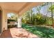 Back patio with built-in grill overlooking the landscaped yard and lawn at 916 Granger Farm Way, Las Vegas, NV 89145