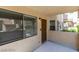 Inviting front entrance with a modern exterior light fixture and neutral color scheme, showcasing a welcoming facade at 924 Falconhead Ln # 102, Las Vegas, NV 89128