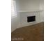 Bright living room with a decorative fireplace and plush carpeting at 924 Falconhead Ln # 102, Las Vegas, NV 89128