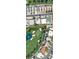 Aerial view of neighborhood showcasing well-manicured golf course, pools, and beautiful homes at 945 Vegas Valley Dr, Las Vegas, NV 89109