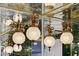 A bathroom featuring vintage crystal and brass pendant lighting and mirrors at 945 Vegas Valley Dr, Las Vegas, NV 89109