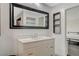 Modern bathroom with updated vanity and framed mirror with decorative shelving at 945 Vegas Valley Dr, Las Vegas, NV 89109