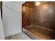 Close-up of a unique bathtub with brown tiles and vintage-inspired design offering a luxurious bathing experience at 945 Vegas Valley Dr, Las Vegas, NV 89109