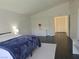 Spacious bedroom with dark wood floors, ample closet space, and bright natural light at 945 Vegas Valley Dr, Las Vegas, NV 89109
