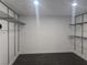 Walk-in closet featuring custom shelving with dark hardwood floors at 945 Vegas Valley Dr, Las Vegas, NV 89109