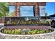 Elegant signage for Las Vegas Country Club Estates, framed by colorful flowers and greenery at 945 Vegas Valley Dr, Las Vegas, NV 89109