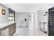 Bright kitchen with stainless steel appliances, white countertops, and a view of the outdoor patio at 945 Vegas Valley Dr, Las Vegas, NV 89109