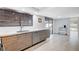 Kitchen with stainless steel appliances, wood cabinets, and sliding glass door to patio at 945 Vegas Valley Dr, Las Vegas, NV 89109