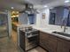 The sleek kitchen is complete with stainless steel appliances, dark wood cabinets, and marble countertops at 945 Vegas Valley Dr, Las Vegas, NV 89109