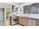 Modern kitchen featuring stainless steel appliances, light countertops, and wood cabinets at 945 Vegas Valley Dr, Las Vegas, NV 89109